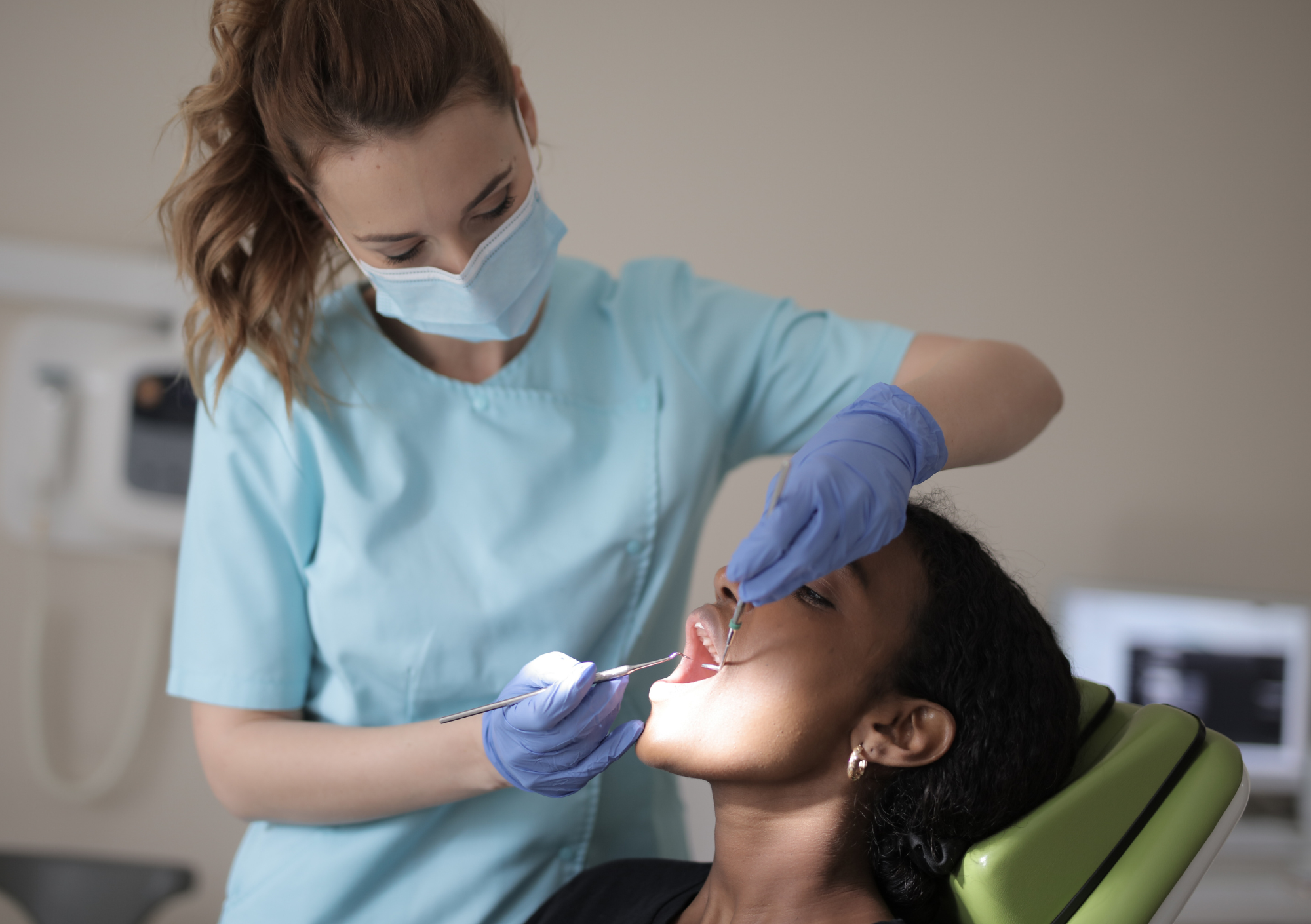 A dentist examining a patient.